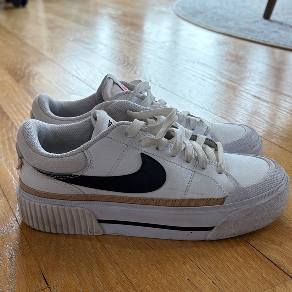 Nike White Low-Top Sneakers with Black Swoosh and Gold Accent - Picture 2 of 15